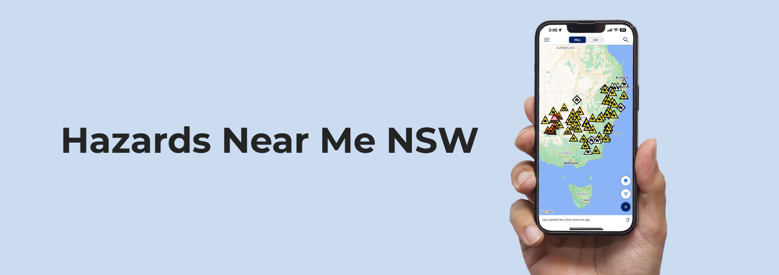 Hand holding a mobile phone displaying the Hazards Near Me NSW app