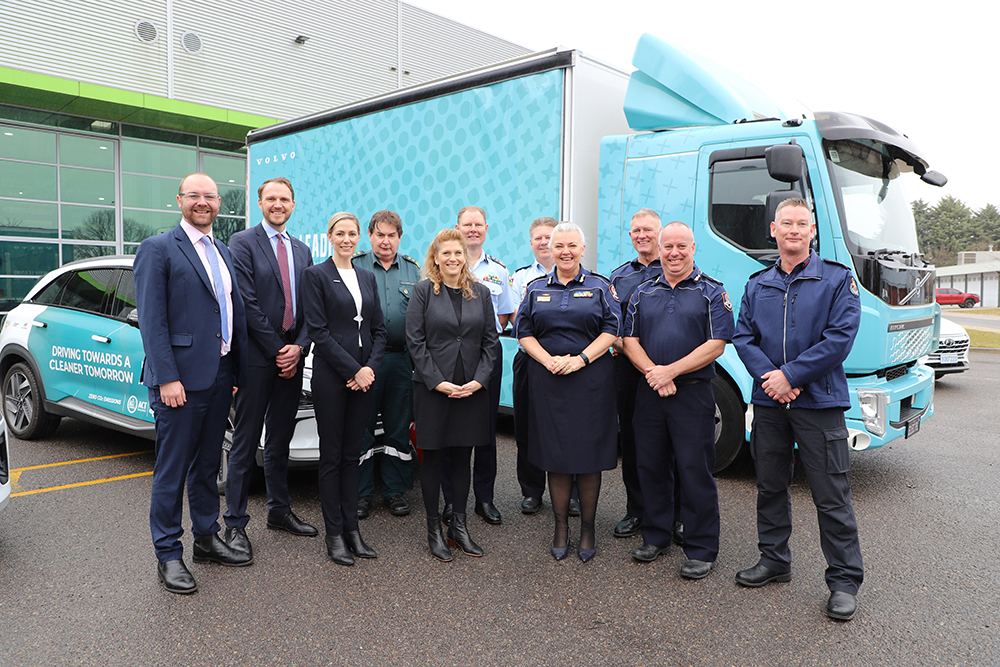 ESA executive team standing in front of a Volvo electric truck