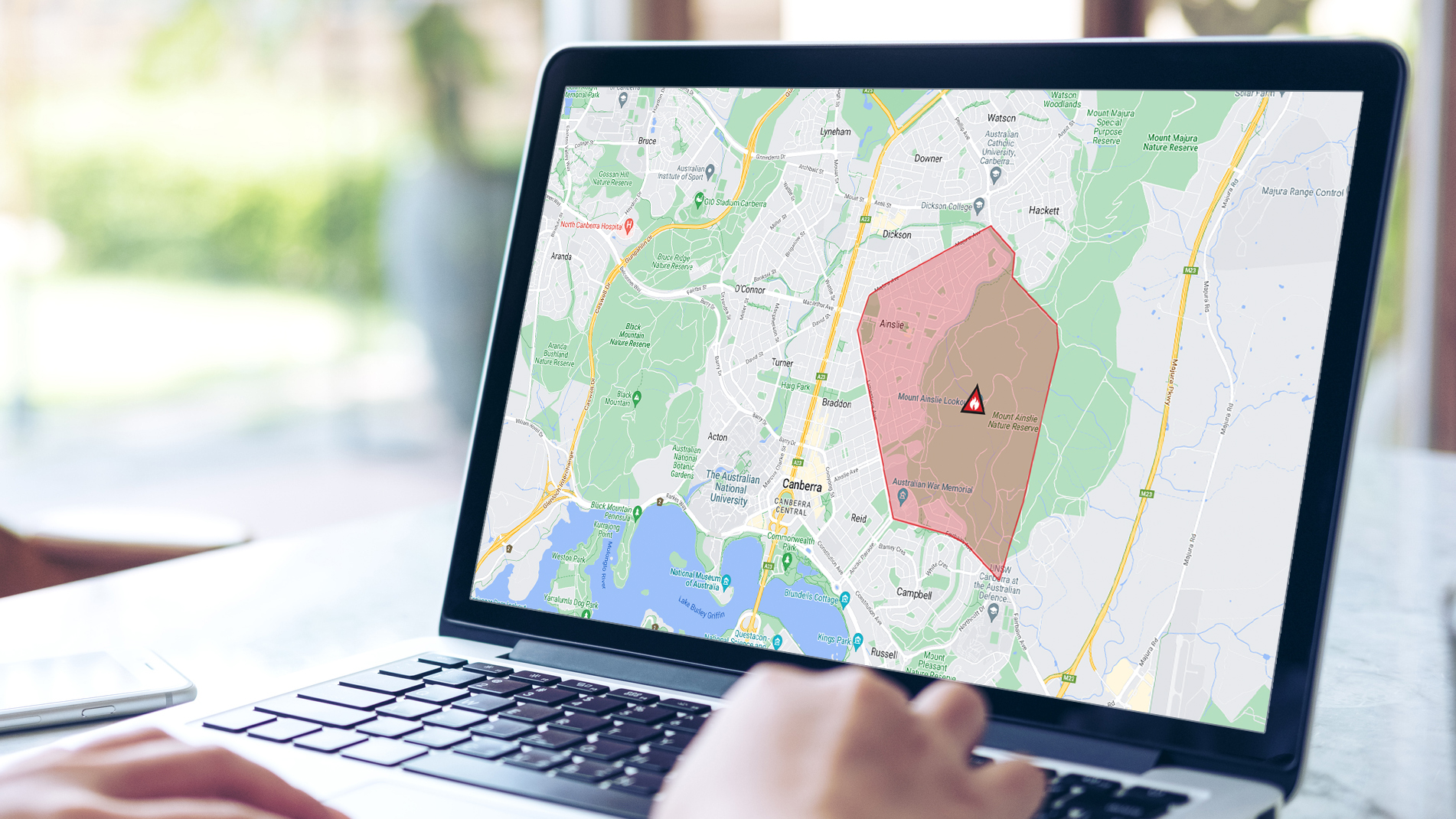 A map on a laptop screen showing a warning area