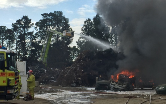 Firefighters work from the Bronto aerial appliance to extinguish the flames at Fyshwick. Photo by Tony Flaherty.