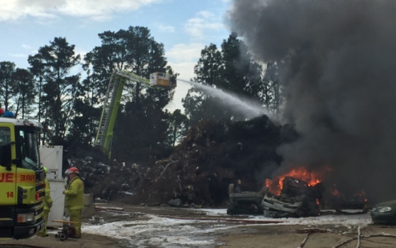 Firefighters work from the Bronto aerial appliance to extinguish the flames at Fyshwick. Photo by Tony Flaherty. 